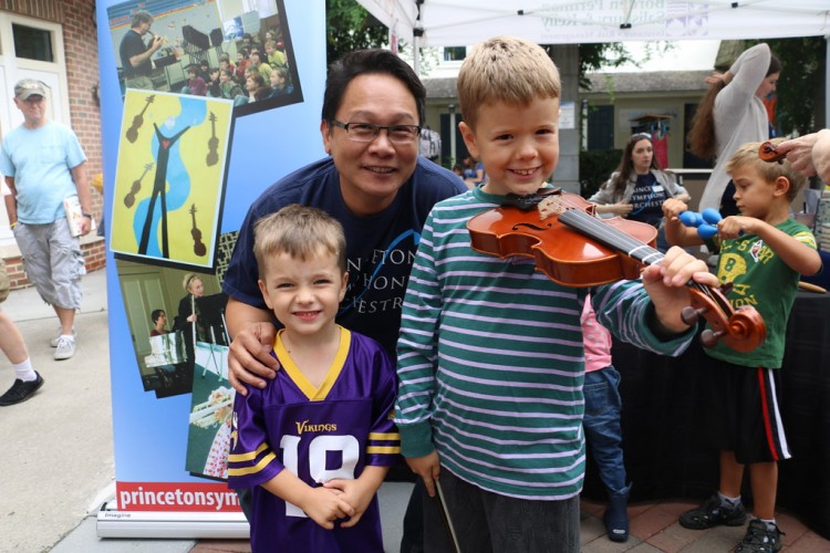 Violinist Kevin Tsai with boys at Instrument Petting Zoo