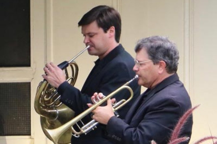Jonathan Clark plays horn and Tom Cook plays trumpet