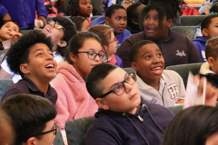 Children in awe of an orchestra concert